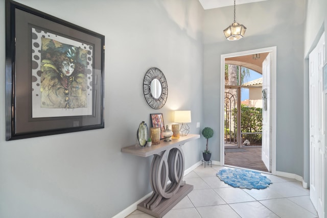 foyer entrance with light tile patterned floors