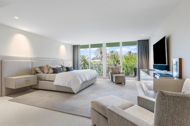 bedroom featuring floor to ceiling windows