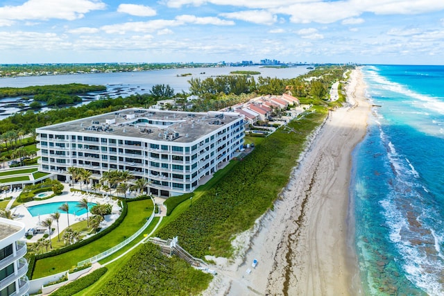 aerial view featuring a view of the beach and a water view