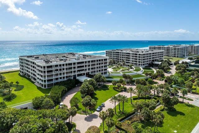 drone / aerial view with a water view and a view of the beach