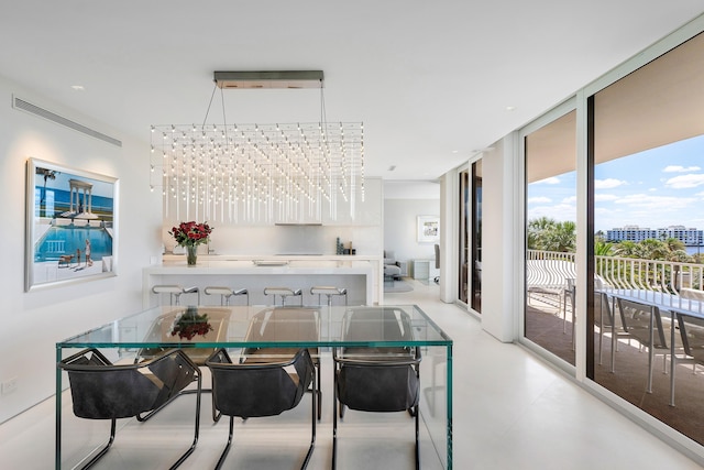 dining area featuring a notable chandelier