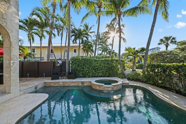 view of pool featuring an in ground hot tub