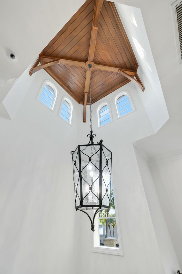 details featuring beam ceiling and wood ceiling