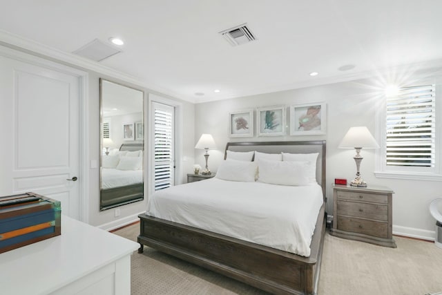 carpeted bedroom featuring crown molding