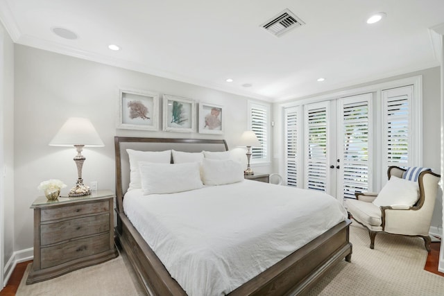 bedroom with access to exterior, light wood-type flooring, and ornamental molding