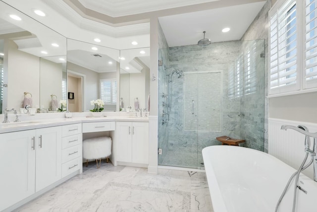 bathroom with vanity, ornamental molding, and plus walk in shower