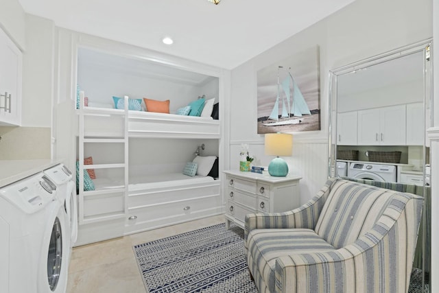 tiled bedroom with washing machine and dryer