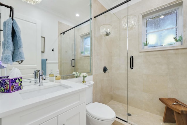 bathroom featuring plenty of natural light, a shower with door, crown molding, and an inviting chandelier