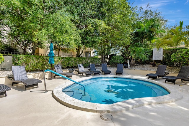 view of swimming pool featuring a patio area