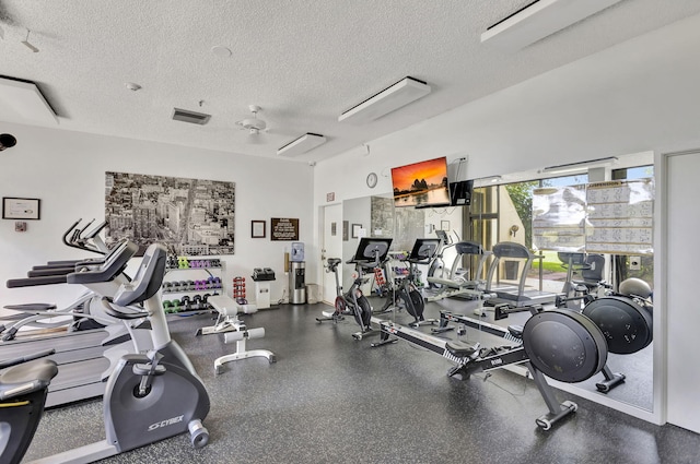 gym featuring a textured ceiling