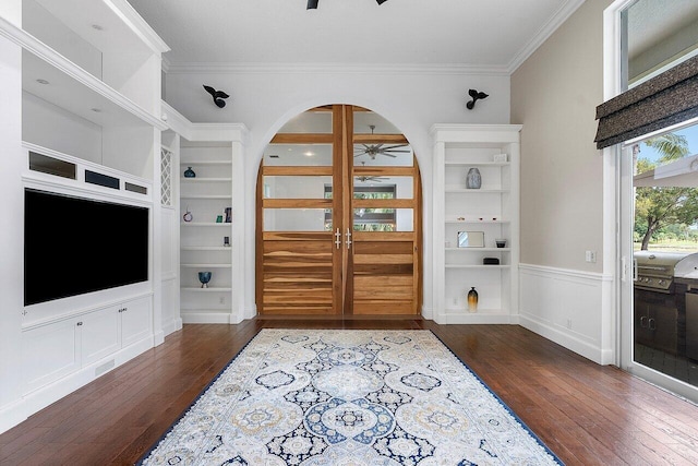 entryway featuring crown molding, dark hardwood / wood-style floors, ceiling fan, and french doors