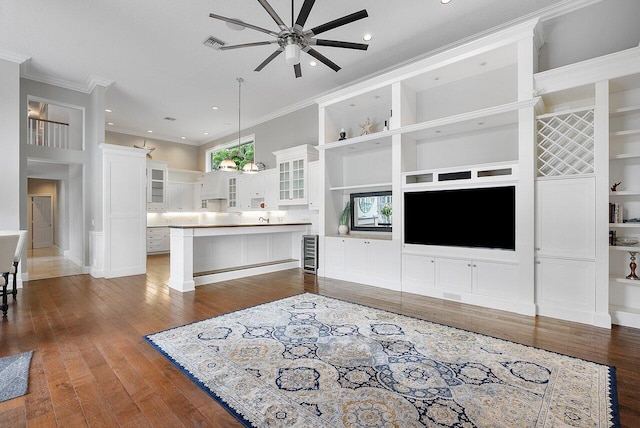 living room featuring ornamental molding, wine cooler, ceiling fan, and dark wood-type flooring