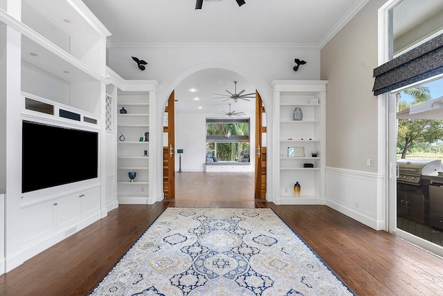 entrance foyer featuring ceiling fan, dark hardwood / wood-style flooring, and a healthy amount of sunlight