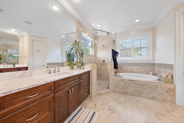 bathroom with vanity, independent shower and bath, and crown molding