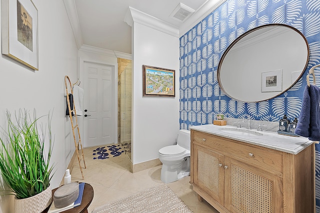 bathroom featuring vanity, tile patterned floors, crown molding, toilet, and a shower with shower door