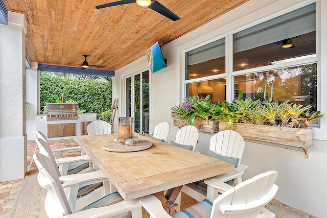 view of patio / terrace featuring an outdoor kitchen, ceiling fan, and a grill