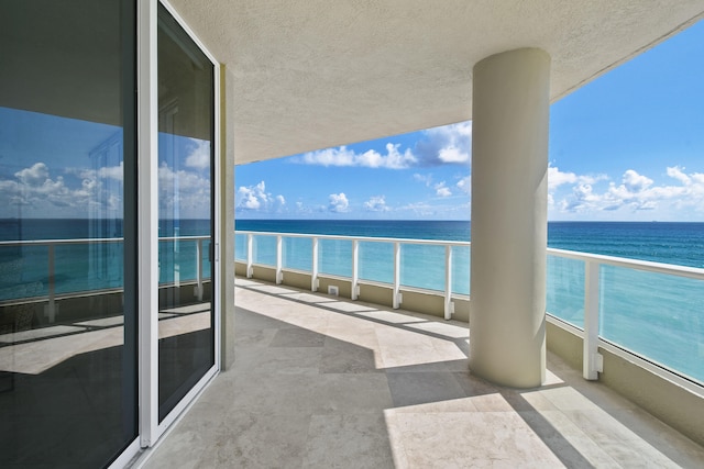 balcony featuring a water view