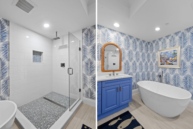 5050 N Ocean Dr Unit 402, Singer Island, FL 33404 - bathroom featuring wallpapered walls, a shower stall, recessed lighting, vanity, and a freestanding bath