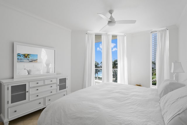 bedroom featuring ornamental molding and ceiling fan