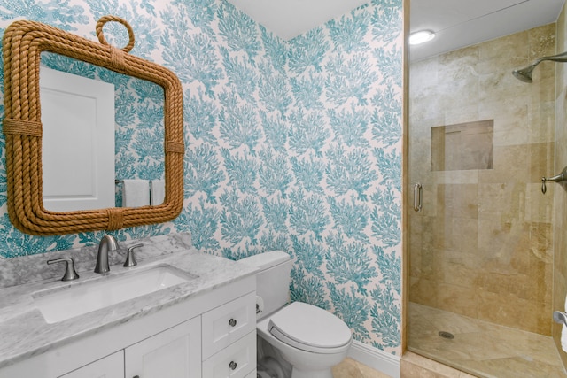 bathroom featuring walk in shower, vanity, and toilet