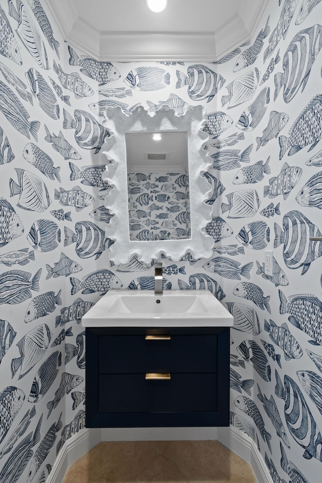 bathroom featuring vanity, ornamental molding, and tile patterned floors