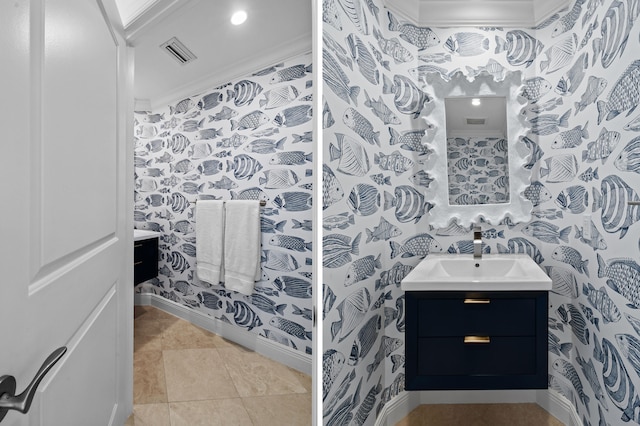 bathroom with vanity, crown molding, and tile patterned flooring