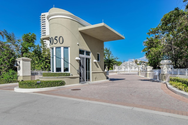 5050 N Ocean Dr Unit 402, Singer Island, FL 33404 - view of building exterior featuring fence