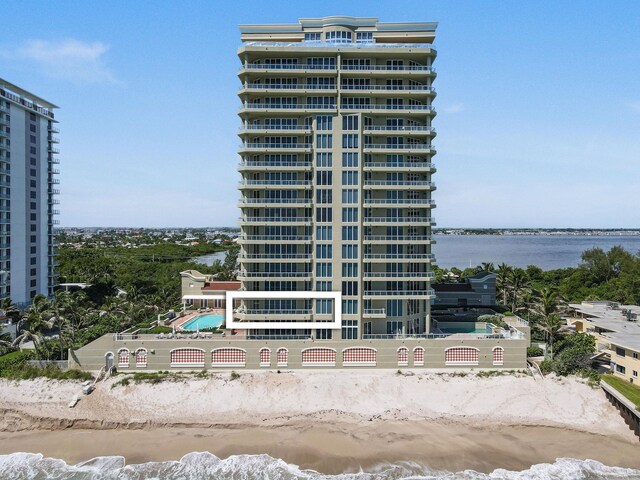 5050 N Ocean Dr Unit 402, Singer Island, FL 33404 - view of building exterior with view of water and beach