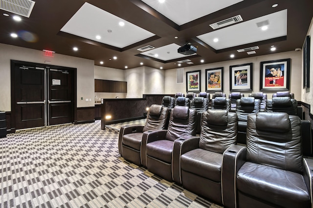 carpeted cinema featuring beam ceiling and coffered ceiling