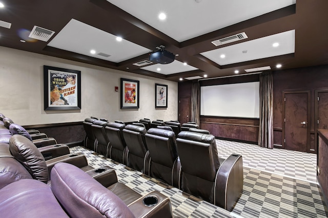 carpeted home theater featuring coffered ceiling and beam ceiling