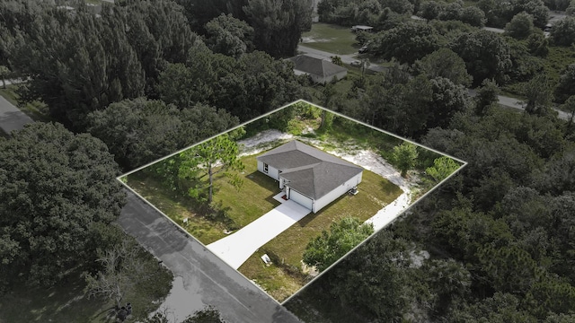 3848 NW 19th Ave, Okeechobee, FL 34972 - aerial view of property and surrounding area featuring property parcel outlined and a forest