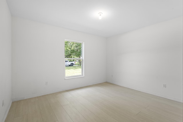3848 NW 19th Ave, Okeechobee, FL 34972 - empty room featuring light wood finished floors and baseboards