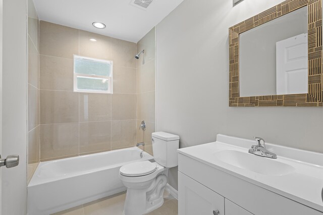 3848 NW 19th Ave, Okeechobee, FL 34972 - bathroom with toilet, vanity, shower / tub combination, tile patterned flooring, and baseboards