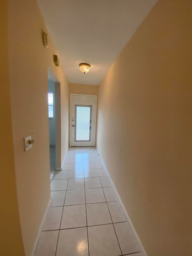 hallway featuring light tile patterned floors