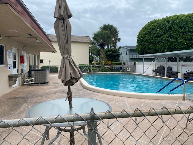 view of pool featuring a patio