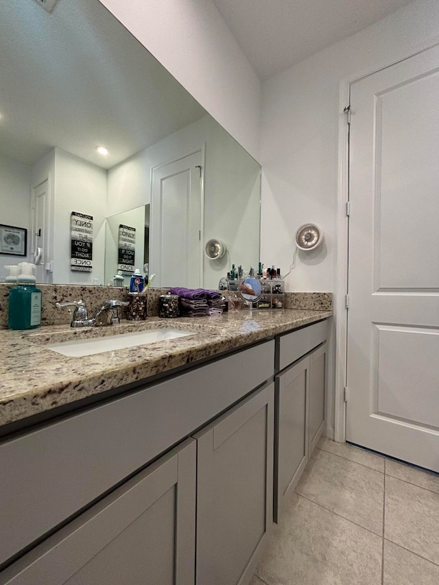 bathroom featuring vanity and tile patterned flooring