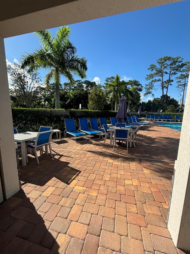 view of patio / terrace featuring a community pool