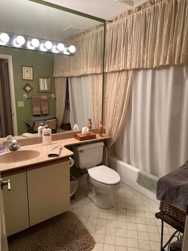 full bathroom featuring vanity, toilet, tile patterned floors, and shower / bath combination with curtain