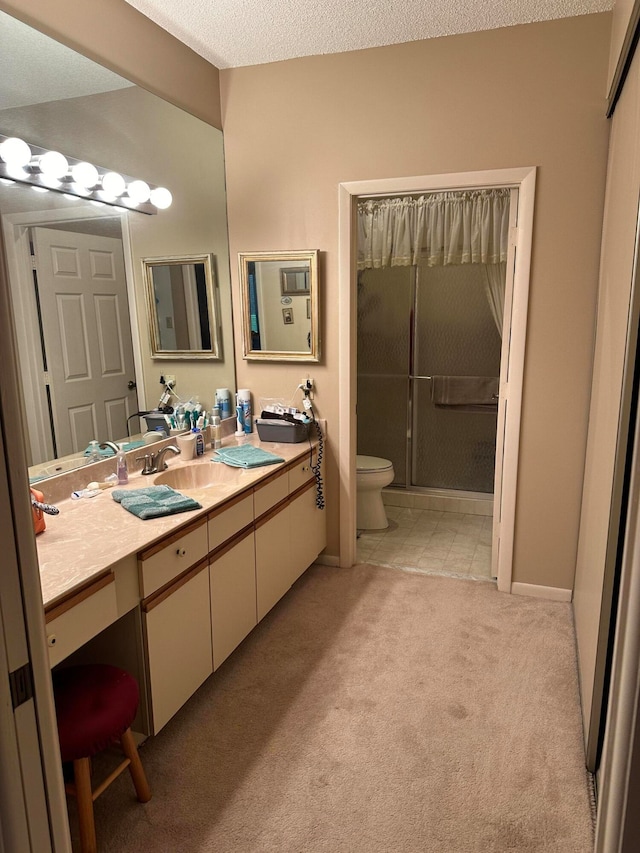 bathroom with a shower with door, toilet, a textured ceiling, and vanity