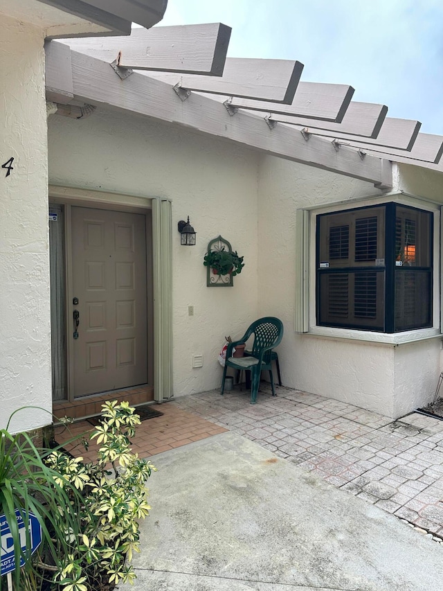 property entrance with a patio