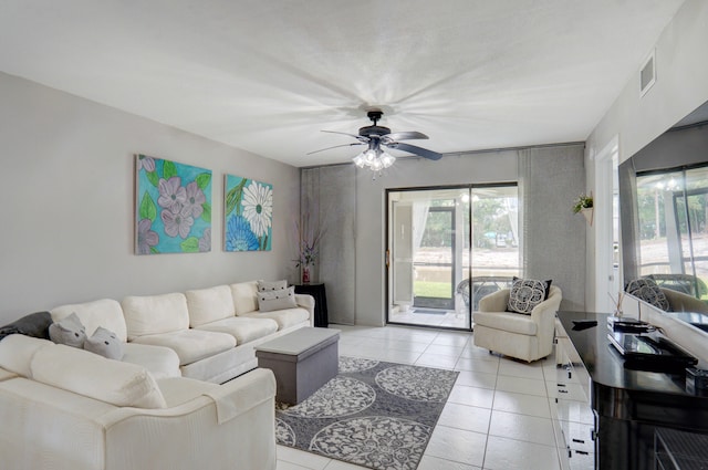 living room with ceiling fan and light tile patterned floors