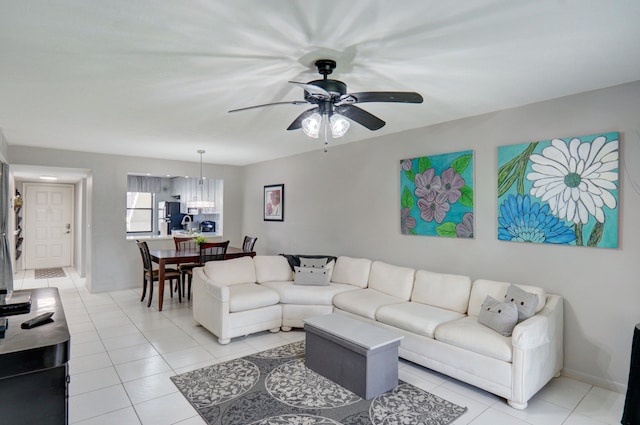 tiled living room with ceiling fan