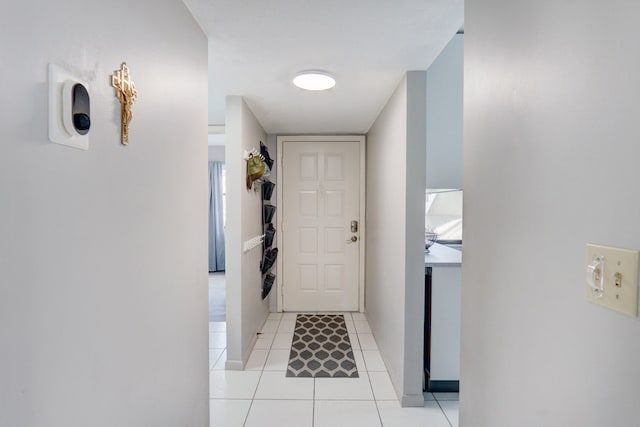 doorway featuring light tile patterned flooring