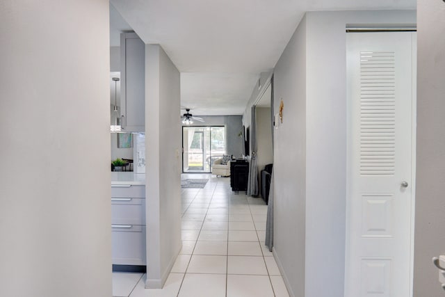 corridor with light tile patterned floors