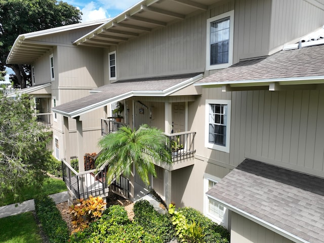 view of side of property with a balcony