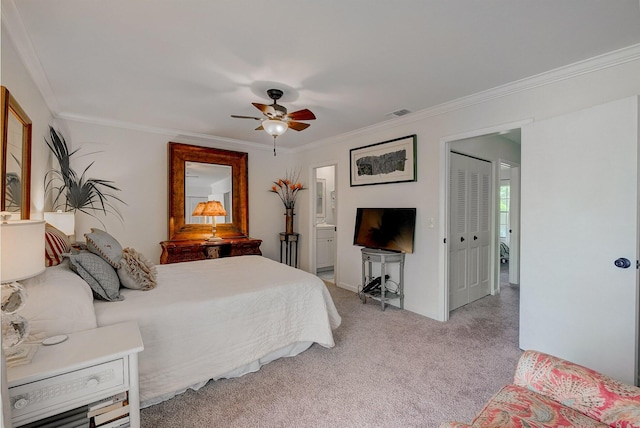 bedroom with ensuite bath, a closet, ceiling fan, ornamental molding, and light colored carpet