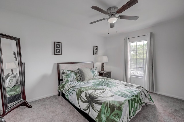 bedroom featuring ceiling fan and light colored carpet