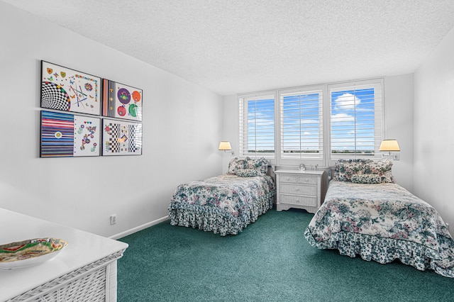 bedroom with a textured ceiling and carpet