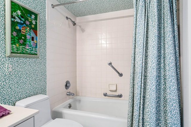 full bathroom featuring shower / bath combination with curtain, a textured ceiling, vanity, and toilet