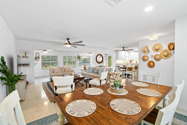 8045 W Lake Dr, Lake Clarke Shores, FL 33406 - dining room featuring a ceiling fan and speckled floor
